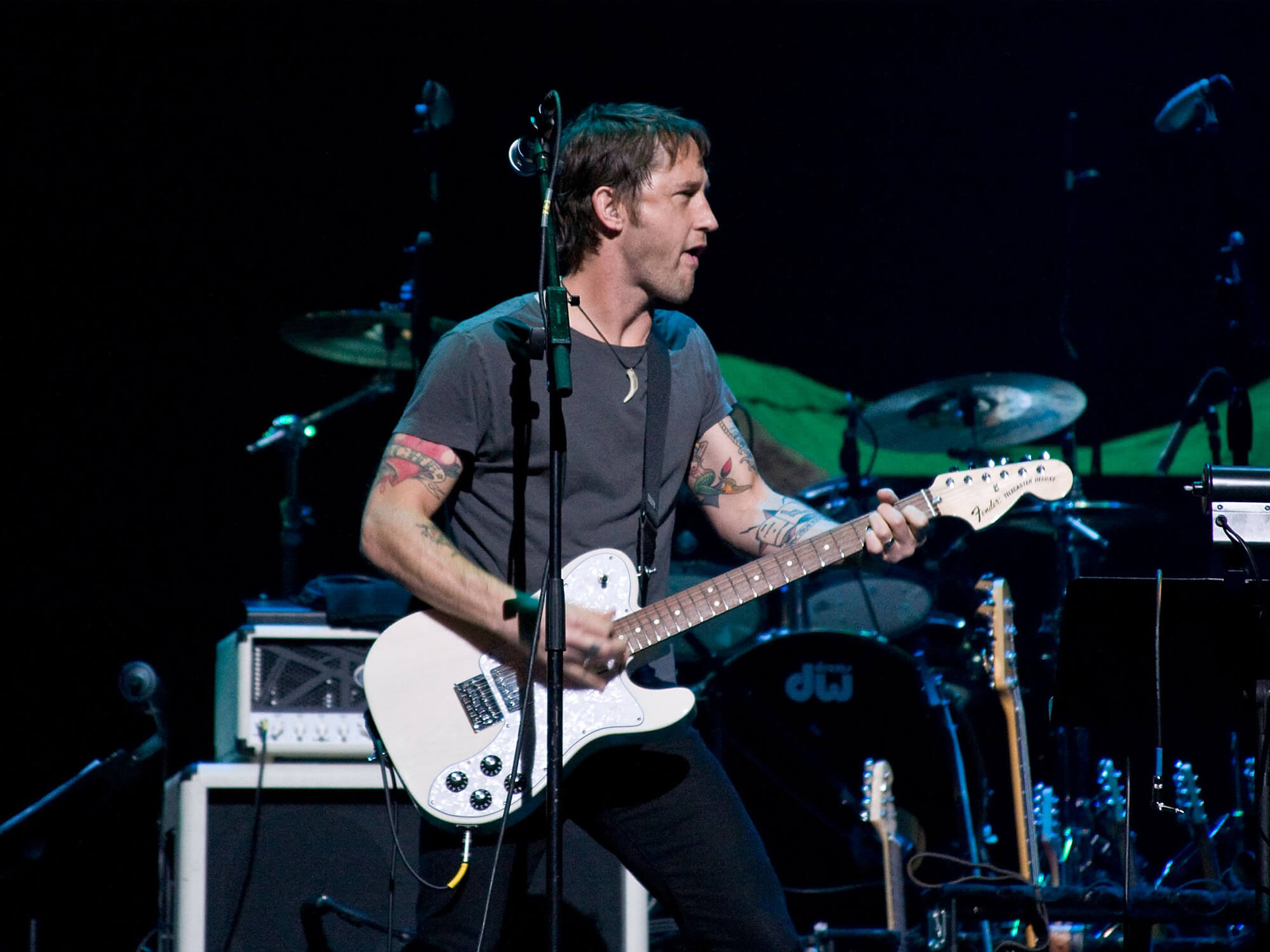 Chris Shiflett in 2012 playing his Telecaster Deluxe on stage.